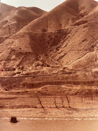 Caves running through the barren, rugged mountain slopes by Ulrich Seidl