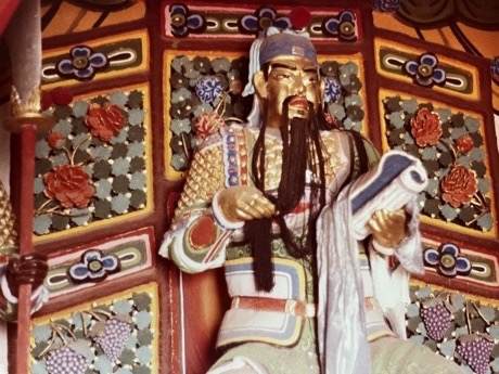 I’m not certain, but the figure appears to be Confucius by Ulrich Seidl