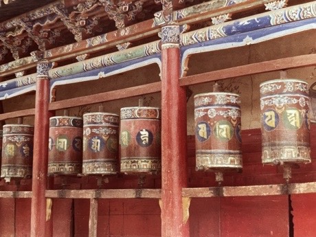 Meditative prayer wheels at Ta’er Monastery, embodying centuries of spiritual devotion by Ulrich Seidl