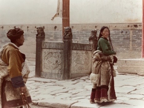 Tibetan pilgrims in front of the entrance to the Ta’er Monastery. by Ulrich Seidl